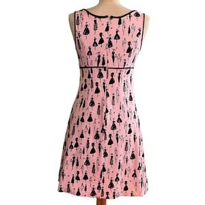 Retro style pink dress w/ black figures